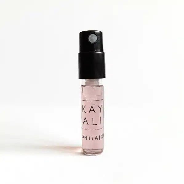Small spray bottle labeled 'KAYALI Vanilla' on a white background